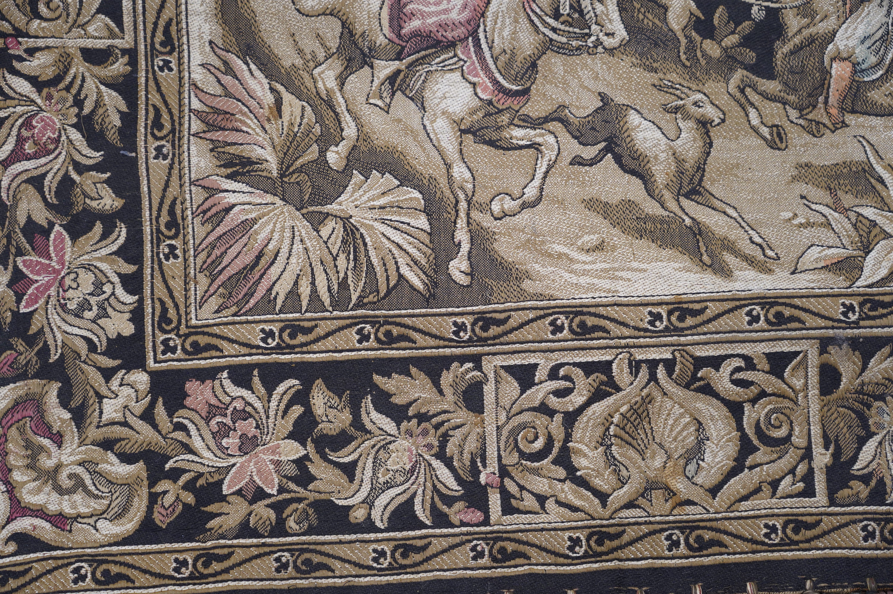 A Belgian Arabic style machine made throw depicting a hunting scene. Condition - fair to good